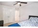Bedroom with a ceiling fan, large closet doors and comfortable-looking bed at 3565 Brycewood Dr, Decatur, GA 30034