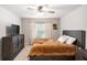 Well-lit bedroom with a ceiling fan, and a TV with a full dresser set at 3565 Brycewood Dr, Decatur, GA 30034