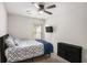 Cozy bedroom with ceiling fan, TV, stylish bedding, and a chest of drawers for ample storage at 3565 Brycewood Dr, Decatur, GA 30034