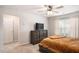 Cozy bedroom with neutral decor, ceiling fan, and ample natural light at 3565 Brycewood Dr, Decatur, GA 30034