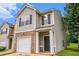 Attractive townhome with brick and siding, dark shutters and a well-kept lawn at 3565 Brycewood Dr, Decatur, GA 30034