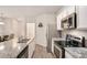 This kitchen features granite countertops, stainless steel appliances, and white cabinets at 3565 Brycewood Dr, Decatur, GA 30034
