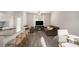 Open-concept living room with a kitchen island, dining area, and comfortable lounge seating at 3565 Brycewood Dr, Decatur, GA 30034