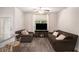 Cozy living room with luxury vinyl floors and comfortable seating with a fireplace at 3565 Brycewood Dr, Decatur, GA 30034