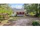 Charming home featuring a spacious backyard with a gazebo and a covered porch at 3919 Mccullers Rd, Loganville, GA 30052