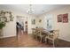 Dining room with wood-look floors, chandelier, and natural light at 3919 Mccullers Rd, Loganville, GA 30052