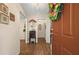 Welcoming foyer features wood-look floors, and decorative lighting at 3919 Mccullers Rd, Loganville, GA 30052