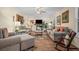 Comfortable living room featuring neutral furniture, area rug, fireplace, and natural light at 3919 Mccullers Rd, Loganville, GA 30052