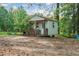 Exterior view of a quaint shed with a porch, providing extra storage or workspace at 3919 Mccullers Rd, Loganville, GA 30052