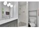Updated bathroom with a modern vanity, patterned tile floor, and stand up shower at 4420 Lake Breeze Dr, Stone Mountain, GA 30083