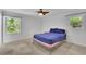 Bright bedroom with two windows and ceiling fan at 4420 Lake Breeze Dr, Stone Mountain, GA 30083