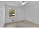 Neutral bedroom with hardwood floors, a window, and closet at 4420 Lake Breeze Dr, Stone Mountain, GA 30083
