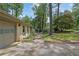 Brick home with an attached two-car garage and a well-maintained lawn at 4420 Lake Breeze Dr, Stone Mountain, GA 30083