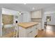 Kitchen with a view into the living room with a brick fireplace at 4420 Lake Breeze Dr, Stone Mountain, GA 30083
