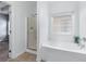 Bathroom featuring a soaking tub and separate shower with glass door at 6045 Park Close, Fairburn, GA 30213