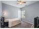 Neutral bedroom featuring one twin bed and a ceiling fan at 6045 Park Close, Fairburn, GA 30213
