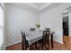 A dining area featuring a modern wallpaper accent wall and wooden table with 4 chairs at 6045 Park Close, Fairburn, GA 30213