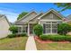 Charming home with green siding, black shutters, and a well-manicured front yard at 6045 Park Close, Fairburn, GA 30213