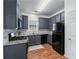 Kitchen featuring gray cabinets, granite countertops, and stainless steel appliances at 6045 Park Close, Fairburn, GA 30213