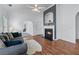 Open living room featuring fireplace, vaulted ceilings, and cozy furnishings at 6045 Park Close, Fairburn, GA 30213
