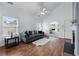 Bright living room featuring a fireplace, vaulted ceilings, and wood flooring at 6045 Park Close, Fairburn, GA 30213
