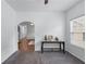 Living room with carpet, archway, table, and view to another living area at 6045 Park Close, Fairburn, GA 30213