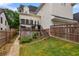 Back yard featuring wooden fence and small deck with chairs at 2685 Grady Se St, Smyrna, GA 30080