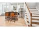 Finished basement with a bar, featuring stone accents, stainless steel appliances, and bar stool seating at 2685 Grady Se St, Smyrna, GA 30080