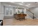 Finished basement with a stone bar, kitchen area, and stairs at 2685 Grady Se St, Smyrna, GA 30080