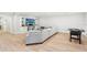 Finished basement with light wood floors, large sectional, built-ins, and a foosball table at 2685 Grady Se St, Smyrna, GA 30080