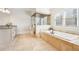 Bathroom featuring a tub, shower, and vanity with granite countertops at 2685 Grady Se St, Smyrna, GA 30080
