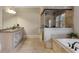 Beautiful bathroom featuring a walk-in shower, soaking tub, and granite countertops at 2685 Grady Se St, Smyrna, GA 30080