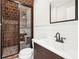 Bathroom featuring a glass-enclosed tiled shower and modern vanity at 2685 Grady Se St, Smyrna, GA 30080