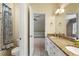 Well-appointed bathroom with a tiled shower and a dual-sink vanity with granite countertops at 2685 Grady Se St, Smyrna, GA 30080