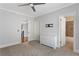 Spacious bedroom with neutral carpet, ceiling fan, and access to an adjoining bathroom at 2685 Grady Se St, Smyrna, GA 30080