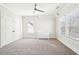 Bright bedroom featuring carpeted floors, ceiling fan, and closet for ample storage at 2685 Grady Se St, Smyrna, GA 30080