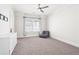 Bright bedroom with a ceiling fan, large window, and neutral color scheme at 2685 Grady Se St, Smyrna, GA 30080