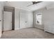 Neutral bedroom with gray walls, carpet floors, ceiling fan and closet at 2685 Grady Se St, Smyrna, GA 30080