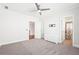 Spacious bedroom with plush carpet, ensuite access and ceiling fan at 2685 Grady Se St, Smyrna, GA 30080