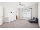 Bedroom featuring plush carpet, ceiling fan, and large window for ample natural light at 2685 Grady Se St, Smyrna, GA 30080