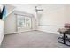 Bedroom with large window, ceiling fan, plush carpet, and a workspace with desk at 2685 Grady Se St, Smyrna, GA 30080