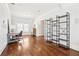 Versatile bonus room with hardwood floors, natural light, and a built-in shelving unit at 2685 Grady Se St, Smyrna, GA 30080