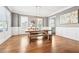 Elegant dining room with wainscoting, hardwood floors, and modern lighting fixtures at 2685 Grady Se St, Smyrna, GA 30080