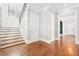 Inviting entryway with hardwood floors, staircase, and elegant trim details at 2685 Grady Se St, Smyrna, GA 30080