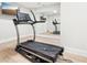 Mirrored exercise room with a treadmill and TV is perfect for staying active at home at 2685 Grady Se St, Smyrna, GA 30080