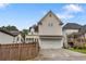 Back exterior view of a two story house with a two car garage and back yard at 2685 Grady Se St, Smyrna, GA 30080