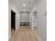 Bright hallway with hardwood floors and built-in shelving at 2685 Grady Se St, Smyrna, GA 30080