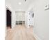 Hallway with light wood floors, built-in shelving, and doorways to other rooms at 2685 Grady Se St, Smyrna, GA 30080