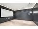 Home theater with a large screen, projector, speakers, and wood-look flooring at 2685 Grady Se St, Smyrna, GA 30080