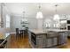 Kitchen featuring a center island, stainless steel appliances and gray cabinets extending to a breakfast nook at 2685 Grady Se St, Smyrna, GA 30080